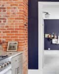 View through kitchen showing countertop and light switch