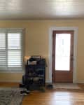 Before: Living room with yellowish beige walls