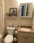 Neutral colored bathroom before renovation.