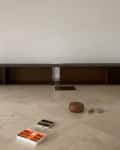 Ikea Billy console and H&M bowl in living room before being re-purposed into high end furniture.
