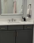 Before: Builder-grade bathroom with gray vanity