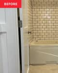 white subway tile, black and white penny tile, white molding, white tub, shower cubby in wall, door way
