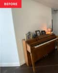 Hallway with piano and a large standing mirror.