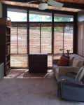 A carpeted sunroom.