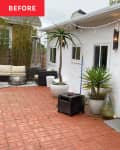 White house with brick patio before remodel