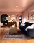 Living room with pink walls and arched thresholds