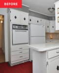 white kitchen with white cabinets and red carpeting before remodel