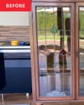 A brown cabinet with glass doors