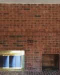 Brick fireplace before renovation.