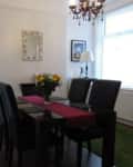 Dark furniture in dining room before renovation.