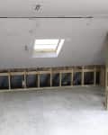 Insulation in walls of bedroom before renovation completion.