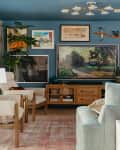 Art filled blue living room.