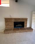 Fireplace in living room before remodel.