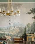 Scenic wallpaper in newly renovated dining room.
