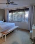 greige bedroom with beige carpet before makeover