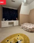 Bed on the floor in child's room.