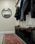 white entryway with runner rug before makeover