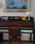 Desk in front of a white wall before painting
