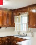 Brown wood cabinetry before kitchen transformation.