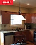 Wooden cabinets in kitchen before renovation.