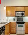 Wooden cabinets in kitchen before renovation.