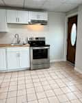 Empty kitchen before renovation.