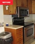 Compact kitchen with wooden cabinets, stainless steel appliances, and a granite countertop.