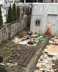 Dwellers looking at backyard before renovation.
