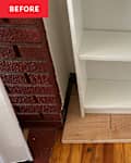 White Ikea bookshelf in corner of living room.