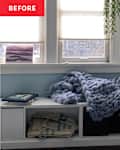 Cozy workspace with a blue chunky knit blanket on a shelf, books, and a desk with a laptop and lamp.