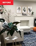 Cozy living room with a white sofa, blue patterned rug, two round chairs, and a fireplace adorned with plants and decor.