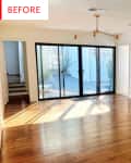 Open-plan kitchen and dining area with hardwood floors, sliding glass doors, and white cabinetry.