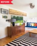 Living room with blue sectional sofa, colorful pillows, wooden coffee table, striped rug, and wall art.