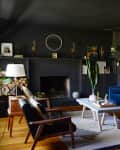 Dark living room with black walls and black ceiling