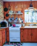 Wood paneled kitchen with brick oven