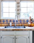 country kitchen with brown and blue glazed tiles