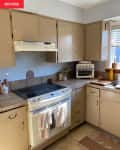 kitchen with tan cabinets before redesign