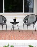 Acapulco chairs in outdoor sitting area.