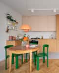 Coral colored small dining room and kitchen in apartment
