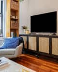 Photo from Lu and Chan's New York house tour - TV on credenza