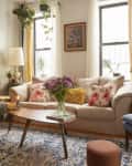Cozy living room in plant filled Brooklyn apartment.
