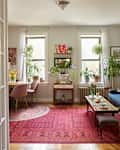French doors opened up to living/dining area in light filled Brooklyn apartment.