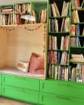 Colorful reading nook with pom poms surrounding reading seating nook.