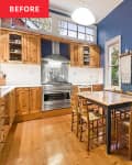 Wooden cabinets in blue painted kitchen.