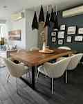 White and gray walls and dining table with boucle chairs