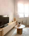 Beige sofa in newly renovated living room.