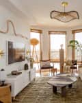 Beige velvet sofa in neutral living room.