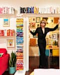 Man standing in doorway with colorful books in white space