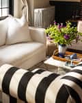 Living room detail of white sofa and black and white striped chair