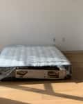 Mattress on apartment floor.